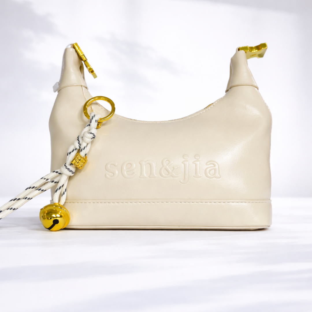 Elegant Cream Mini Shoulder Bag with Gold Charm